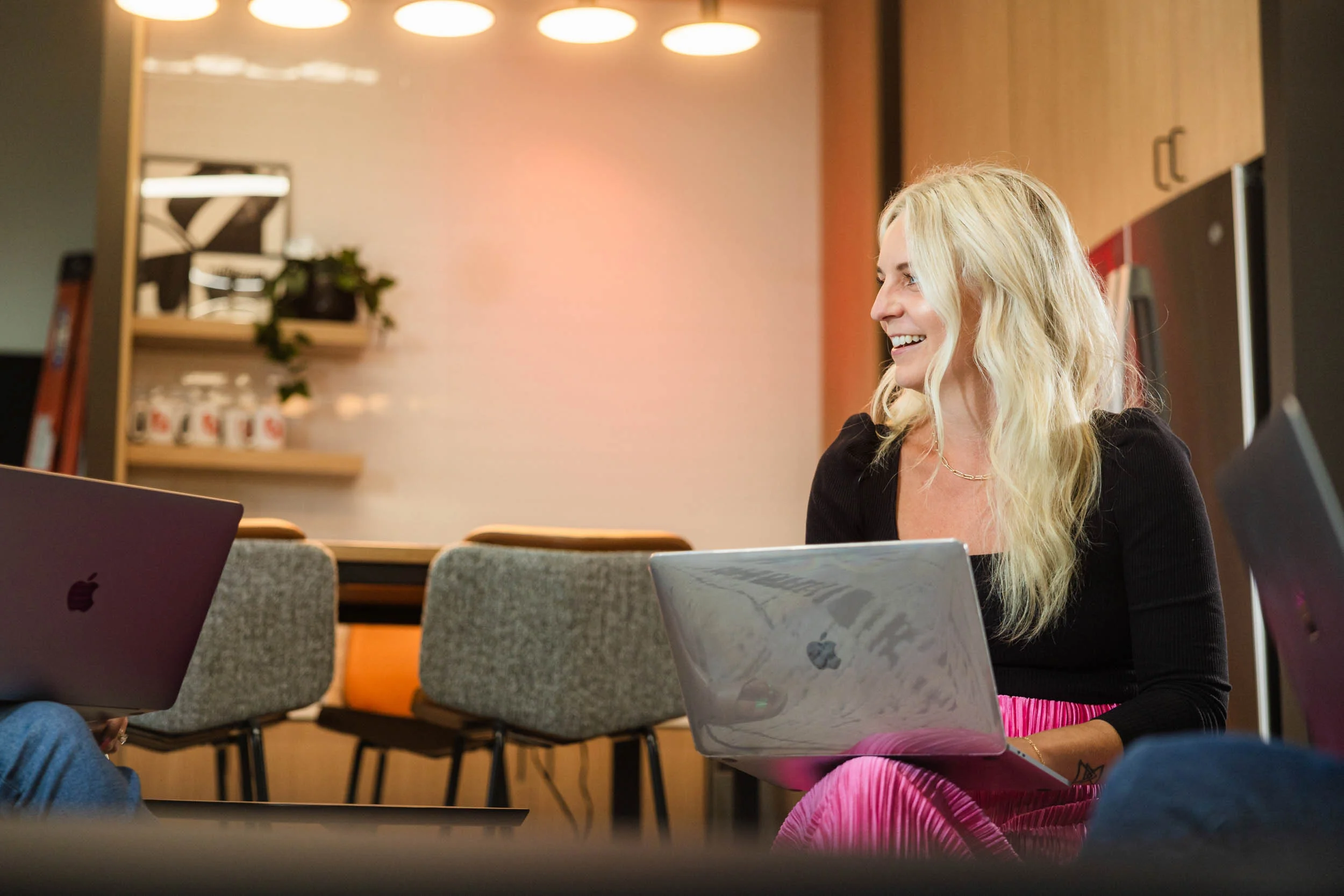 Girl on laptop smiling