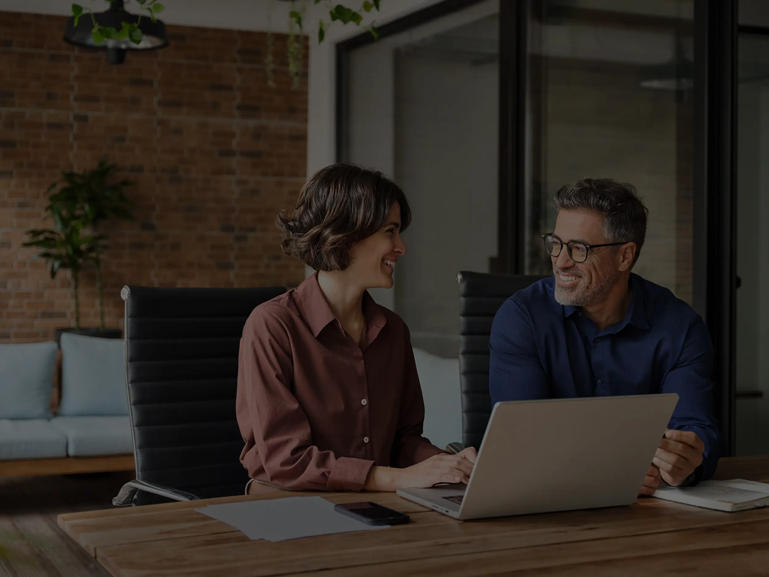 couple smiling with computer