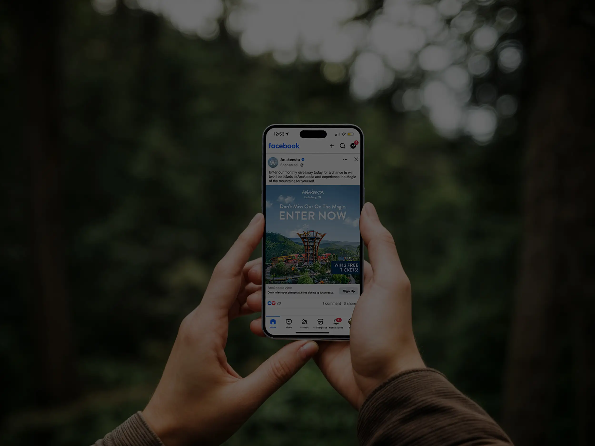 hand holding phone with social post mockup