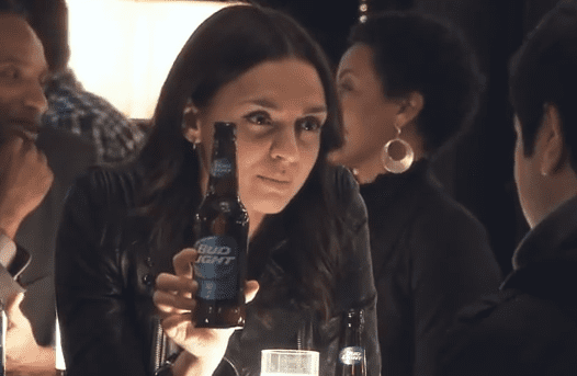 Woman holding a beer