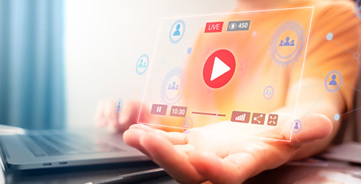 Hand holding a hologram of a live video stream