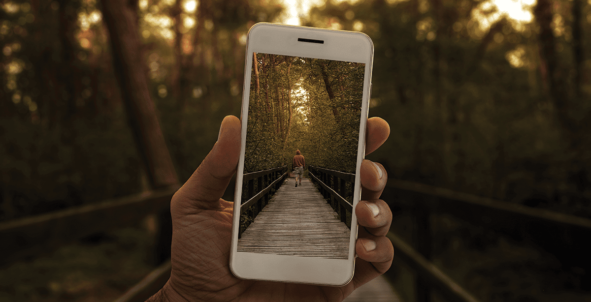 Someone photo capturing a man running on a bridge