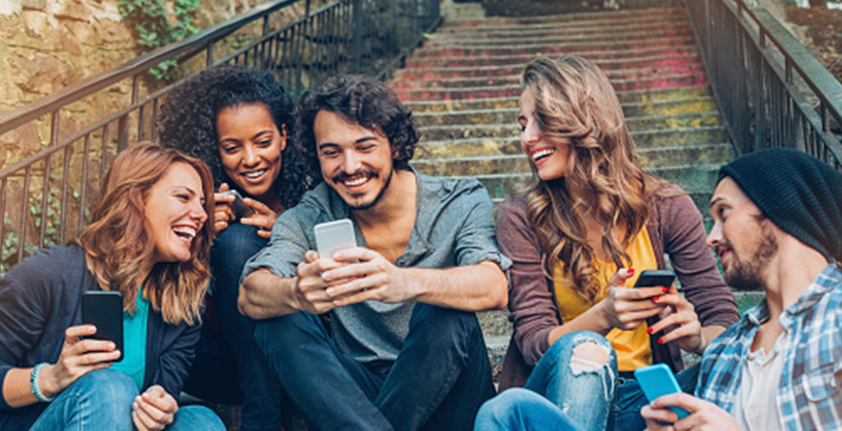 Group gathered around looking at a phone