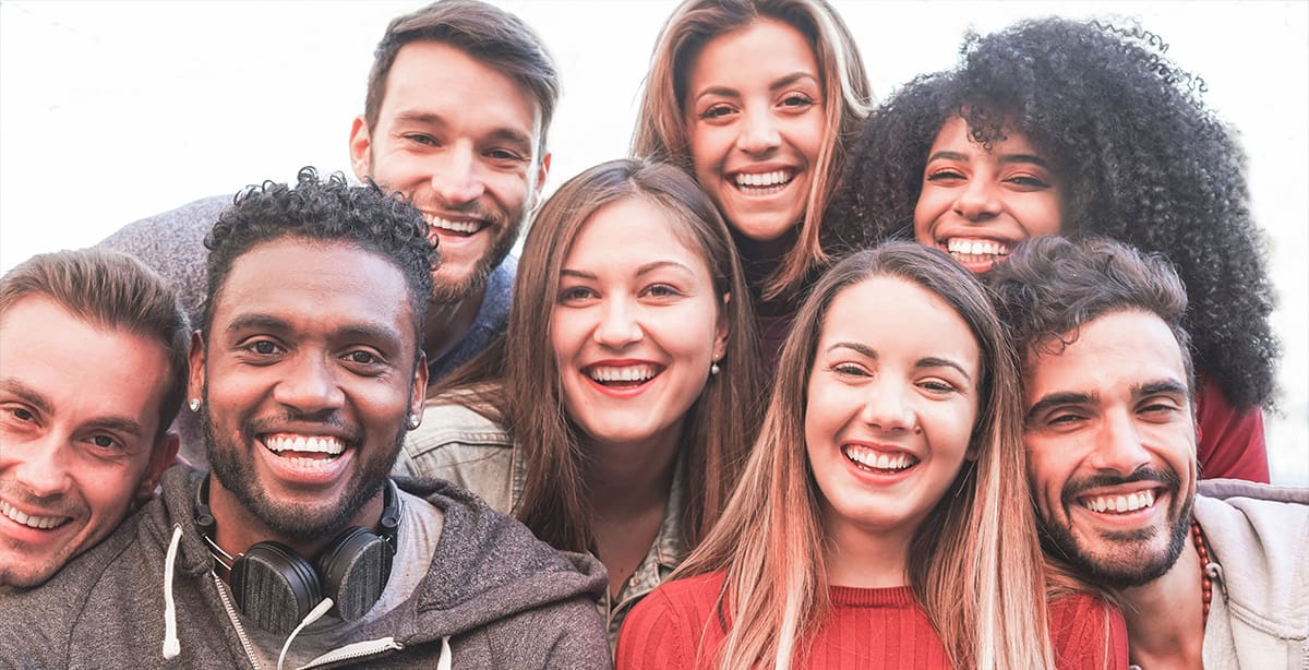Group of people smiling in a group photo