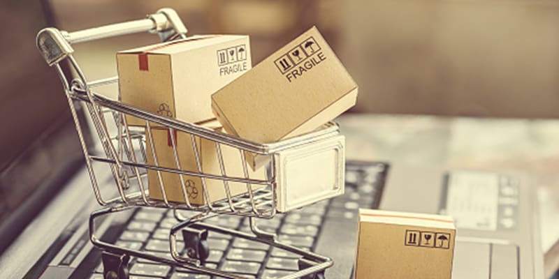 Shopping cart with boxes piled high