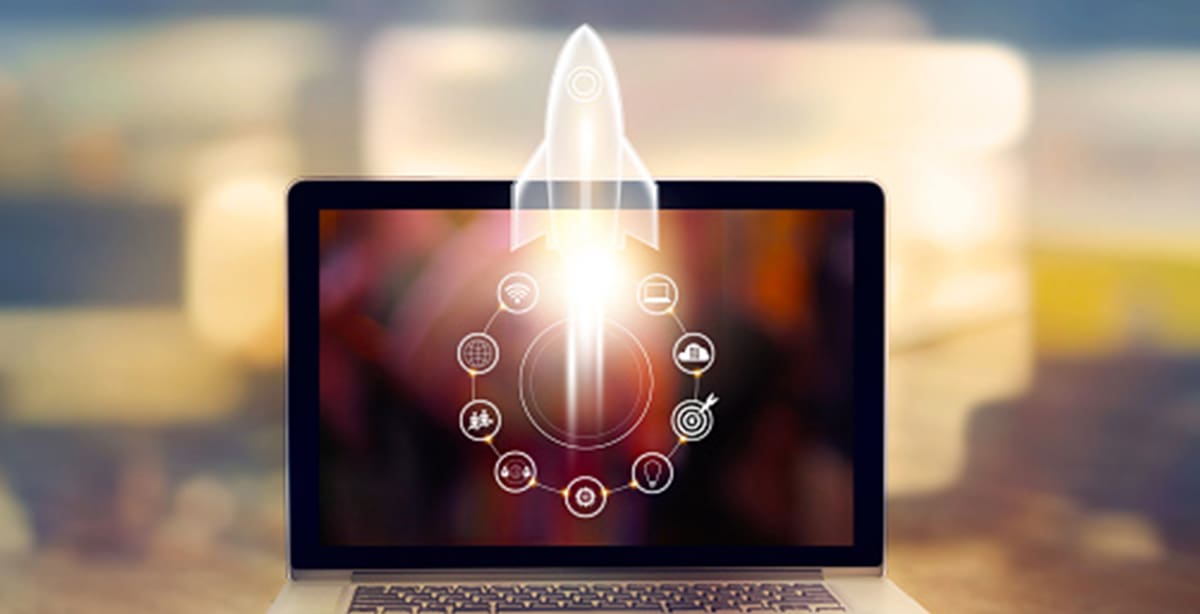 Rocket taking off from computer screen