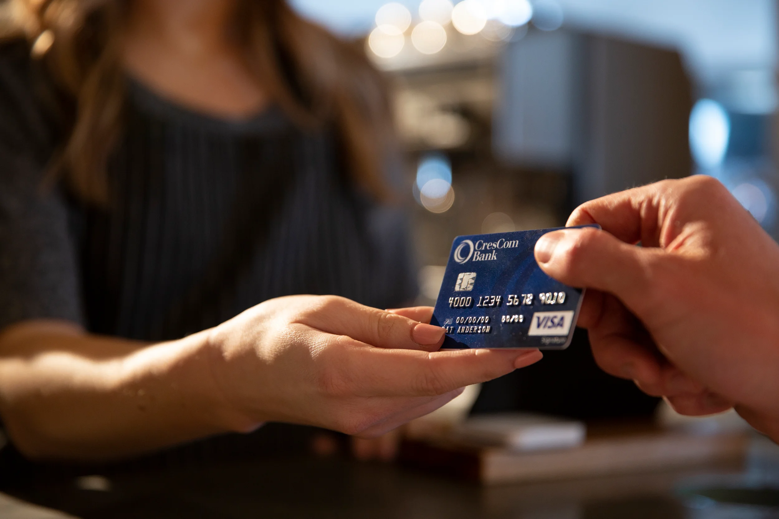 people passing credit card