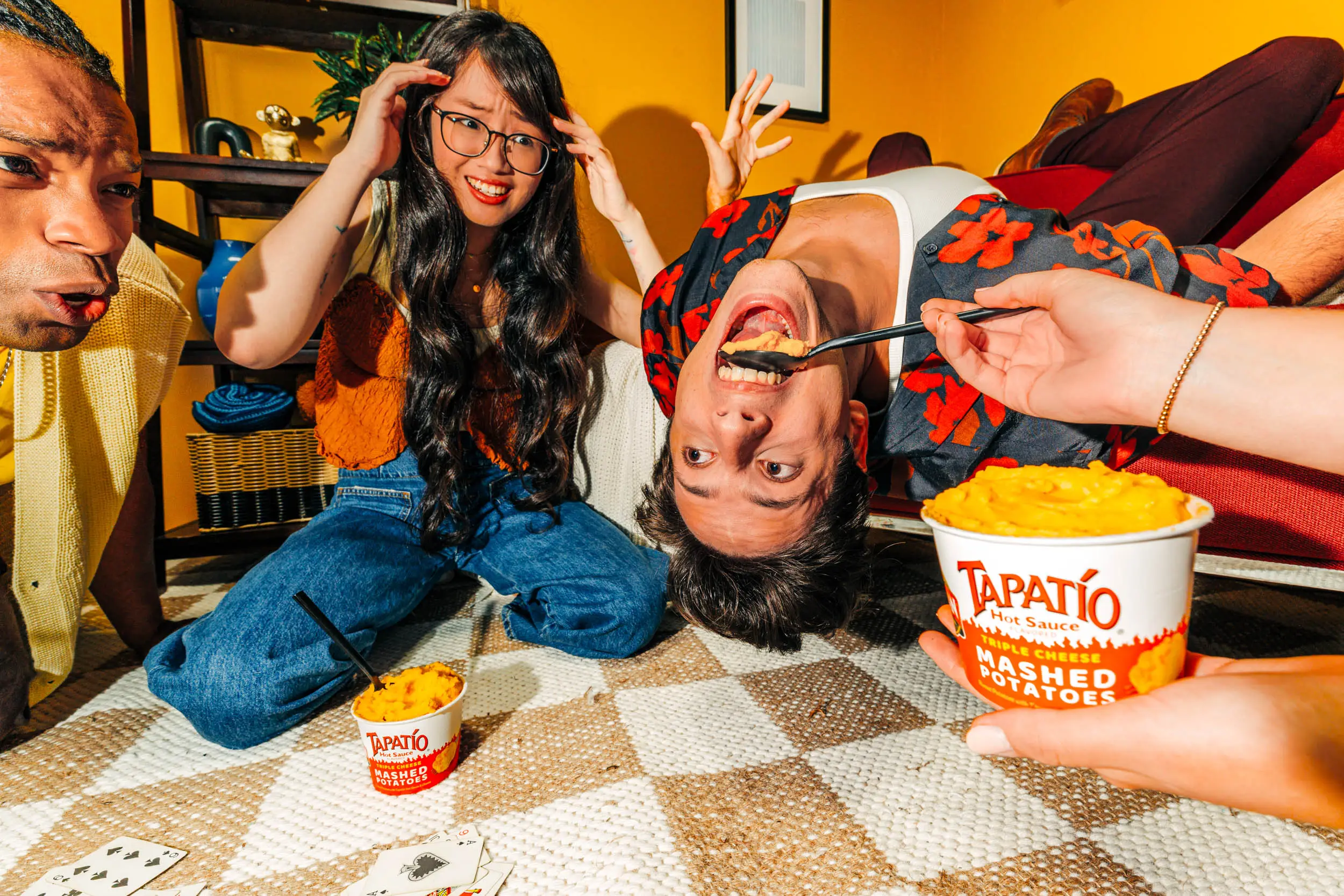 guy upside down eating potatoes