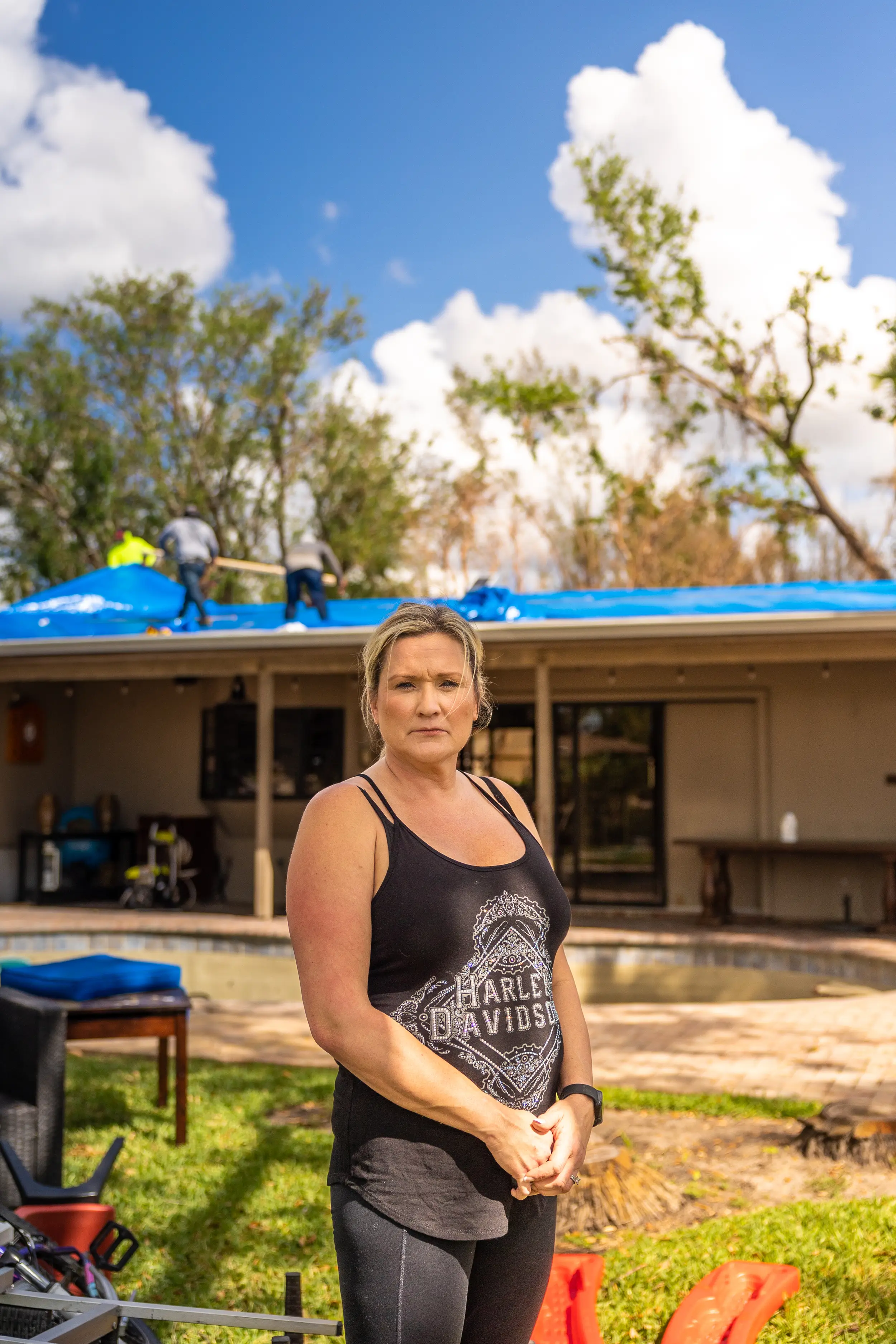 lady looking at camera, in devastation