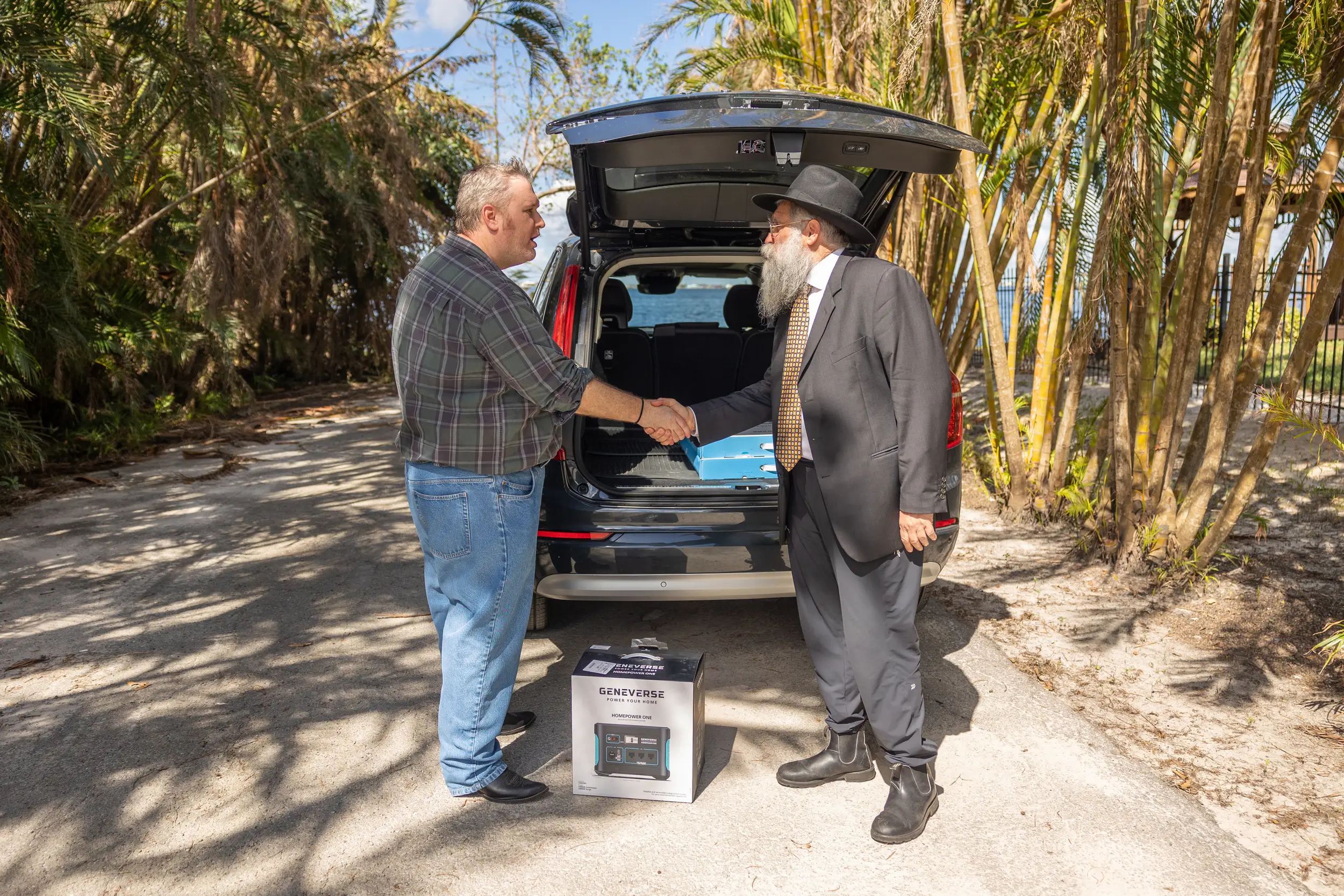 men shaking hands receiving geneverse generator