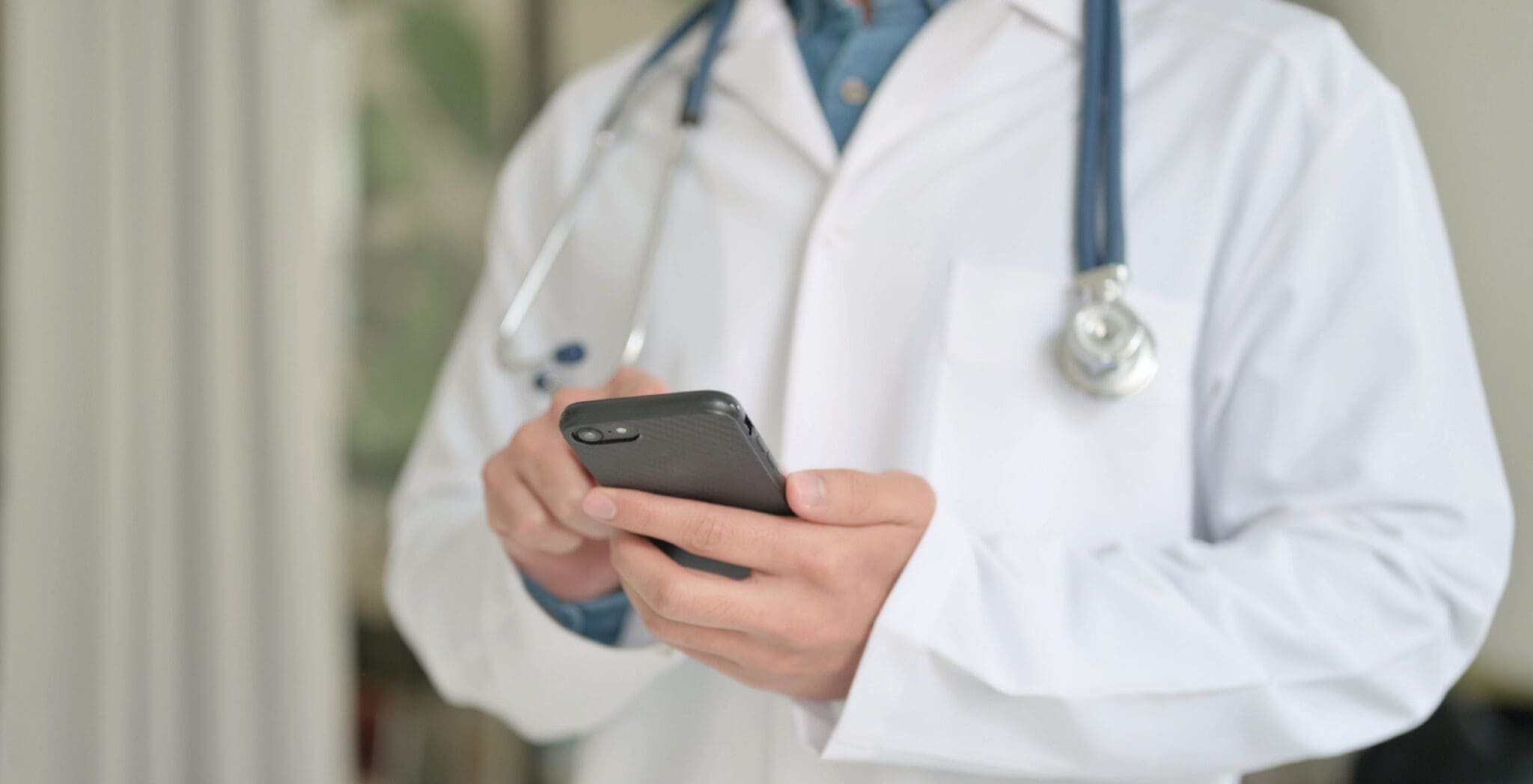 Doctor Holding Phone