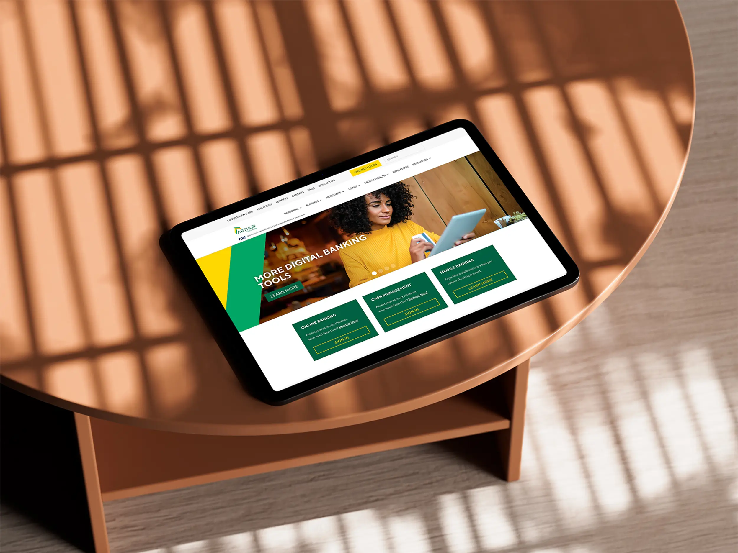 tablet with arthur state bank website