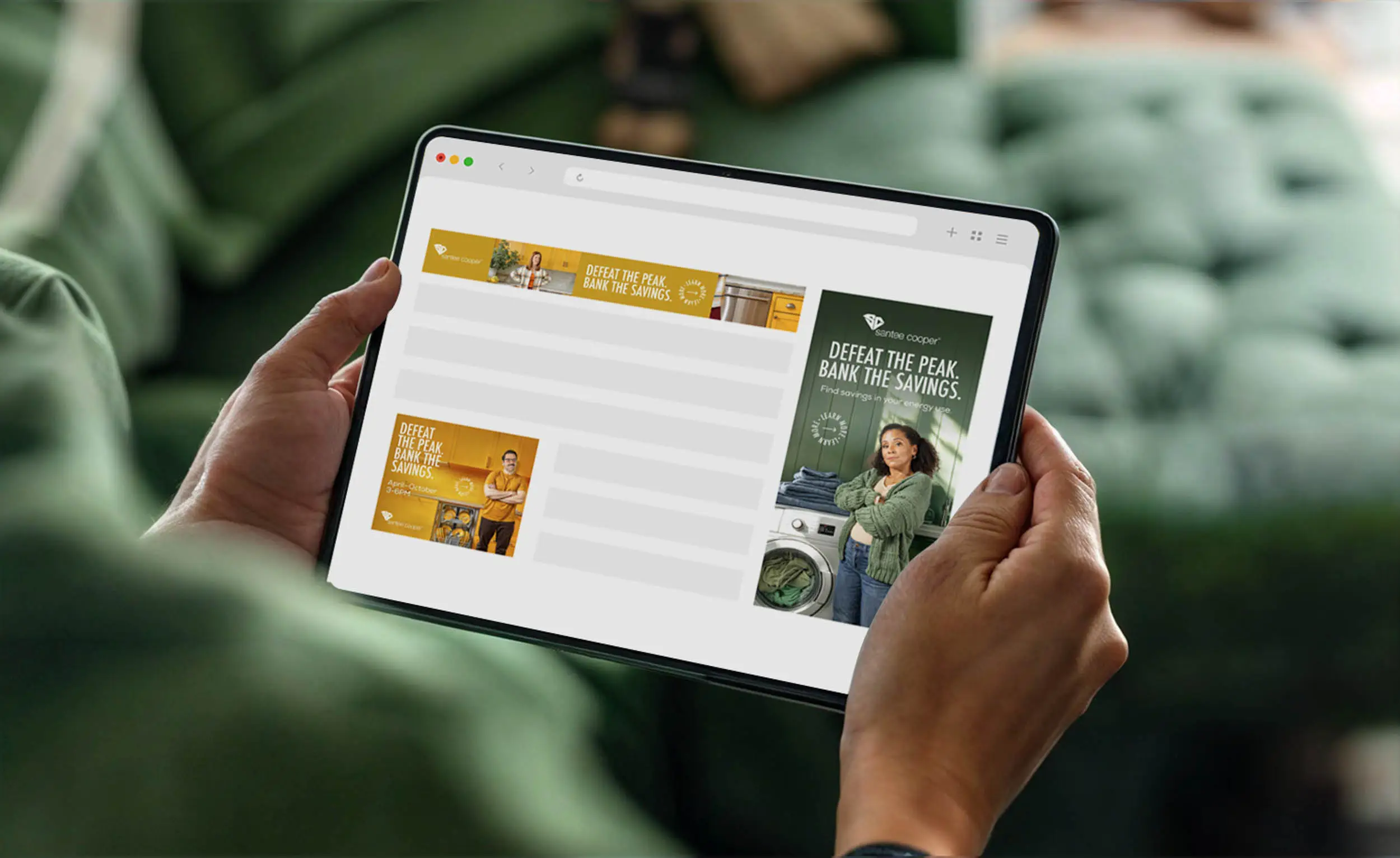 person holding tablet with santee cooper banner ads