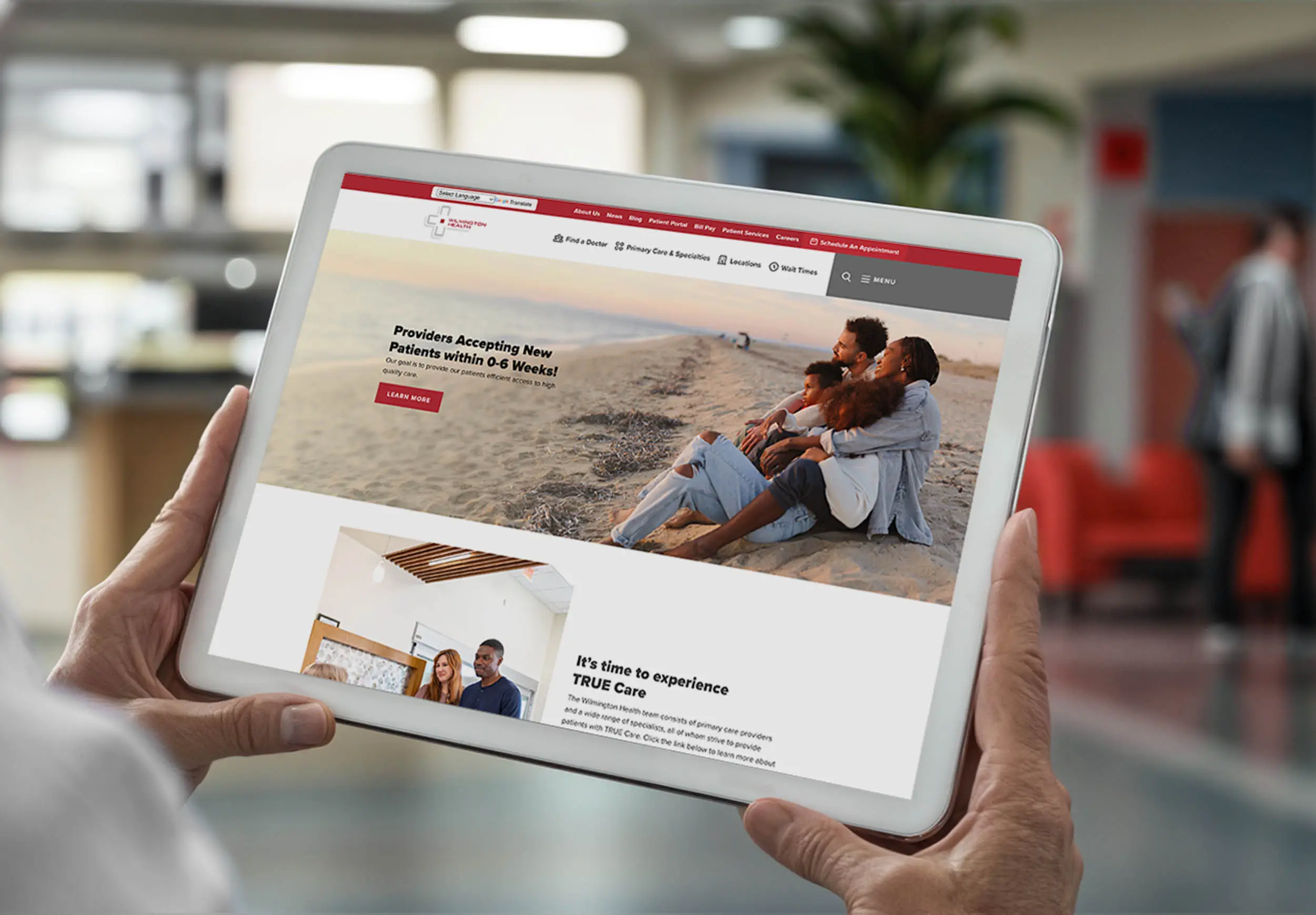 Person holding tablet with wilmington health website