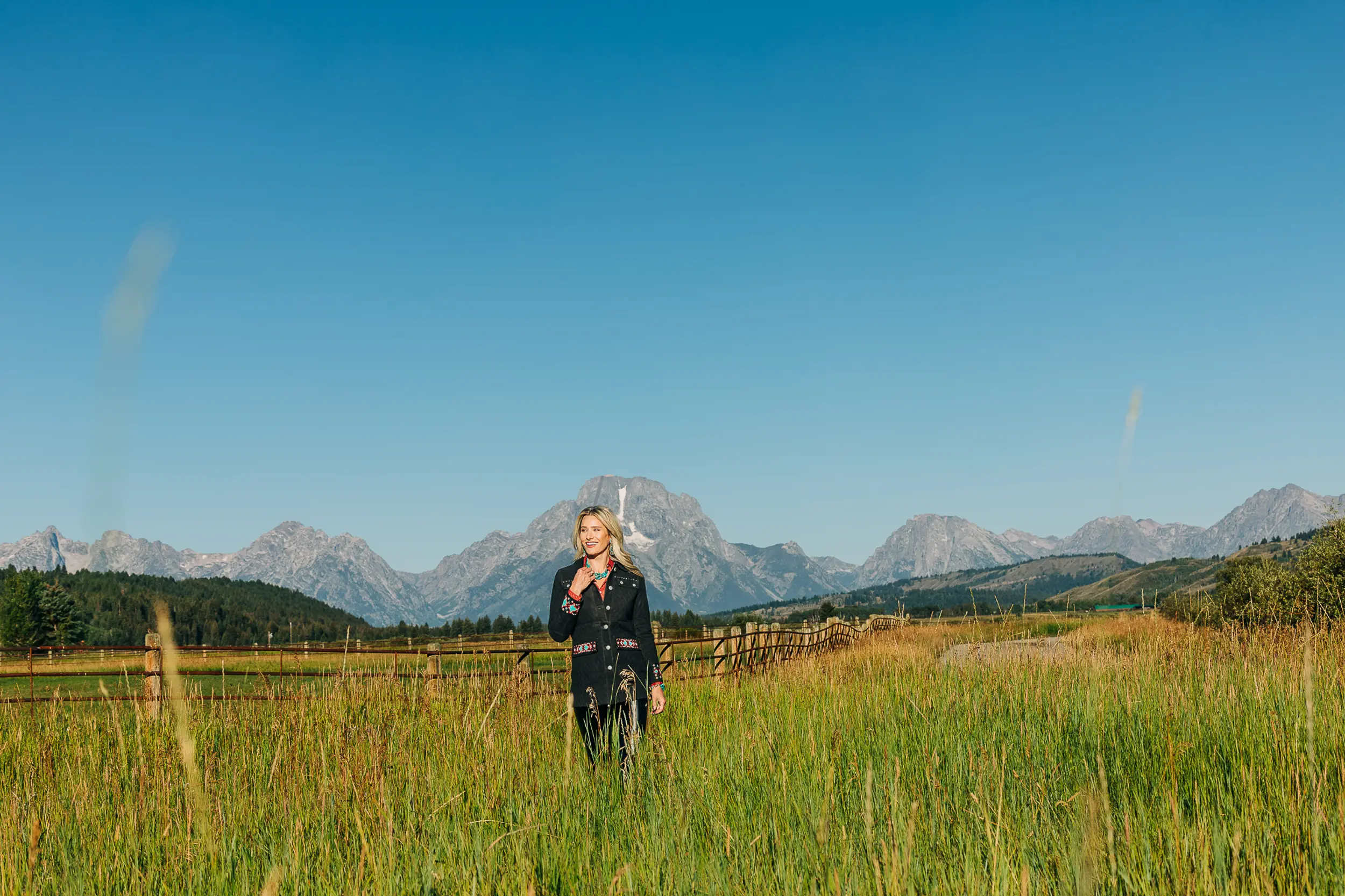 lady in western wear with mountains
