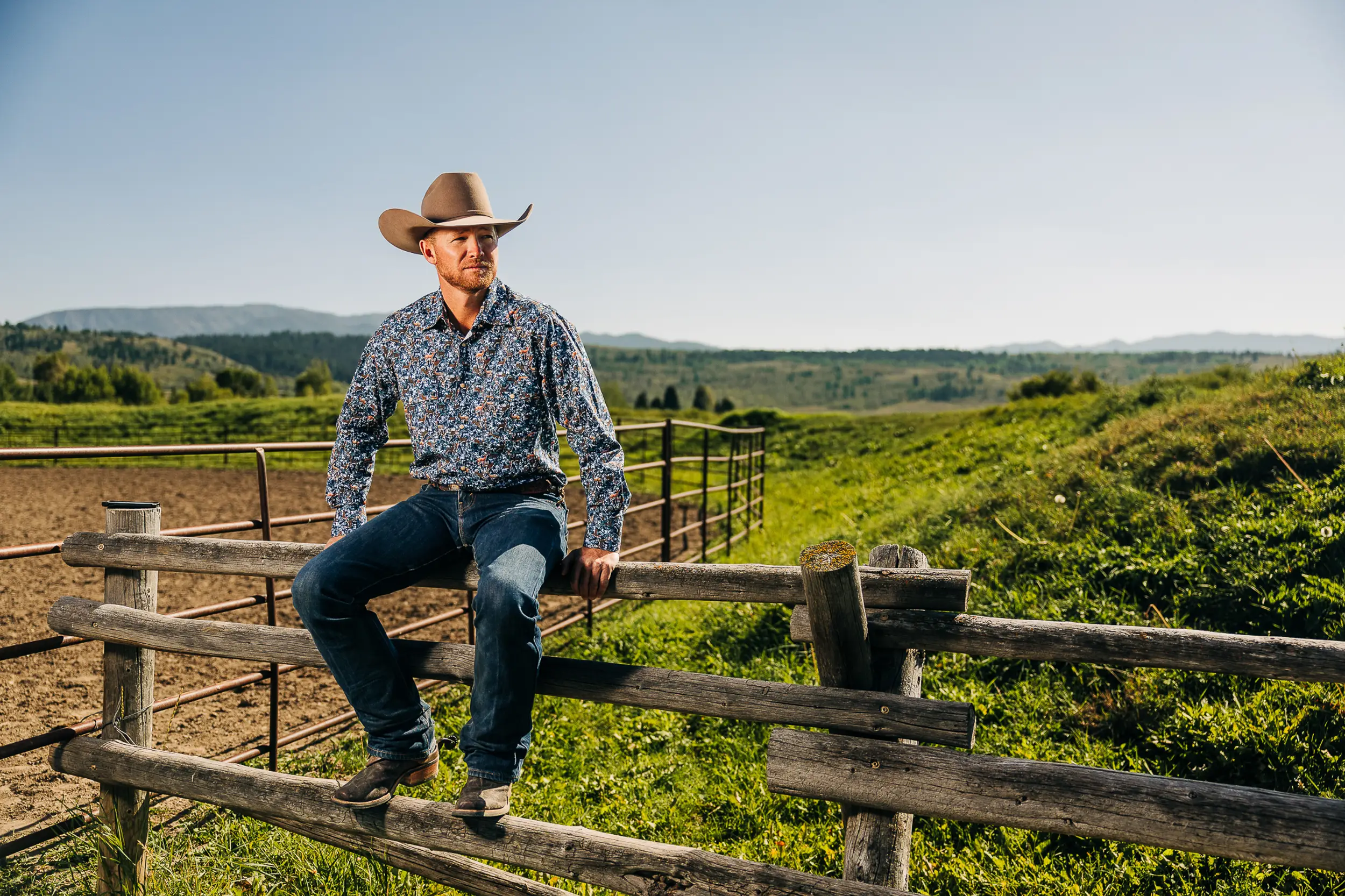 man sitting on fence