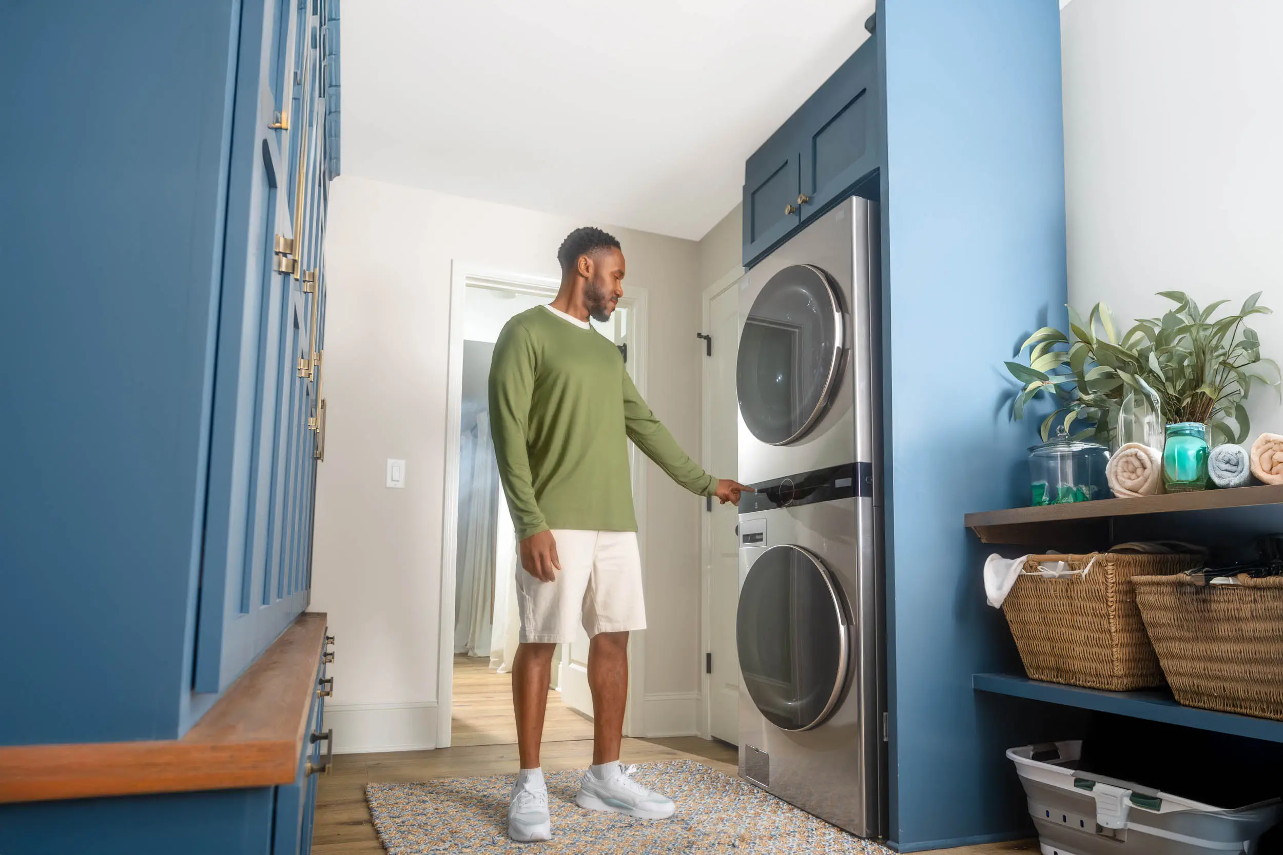 man loading washing machine