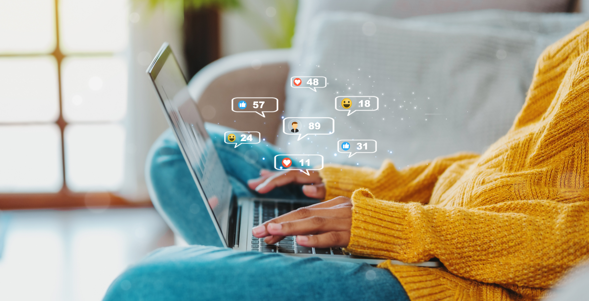 holding laptop, social icons