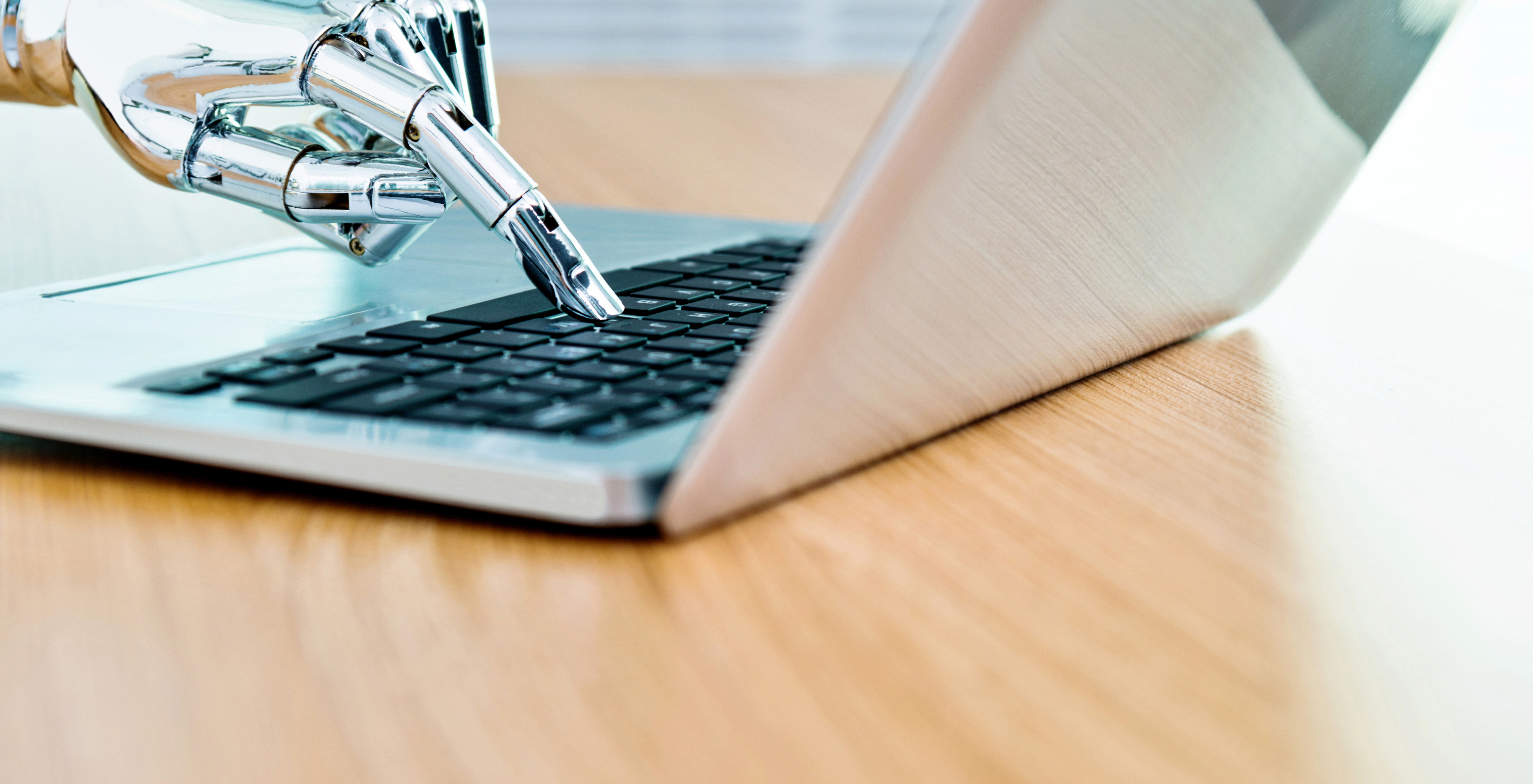 Robot typing on computer