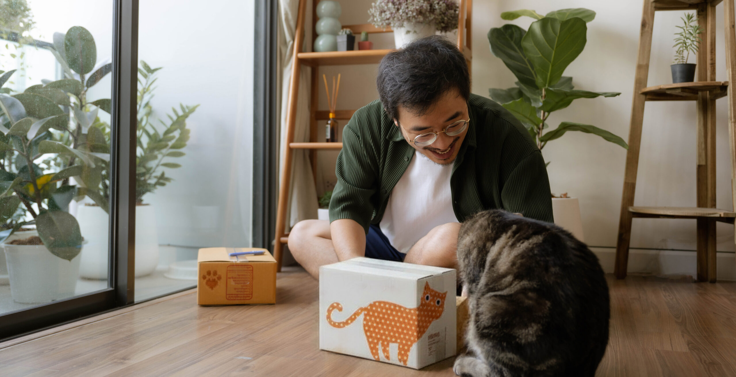 man with cat and box