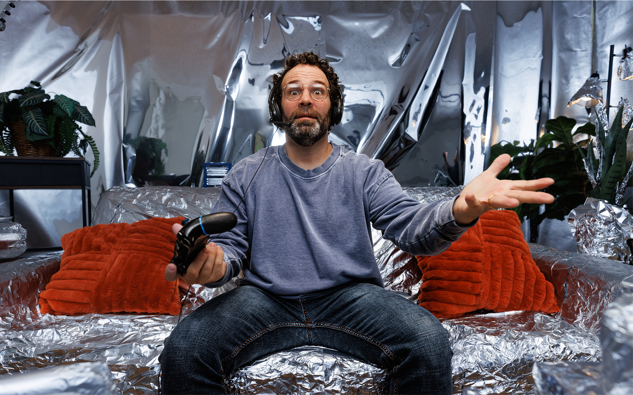 man sitting on tin foil couch